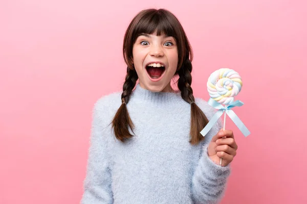 Little Caucasian Girl Holding Lollipop Surprise Facial Expression — Stockfoto