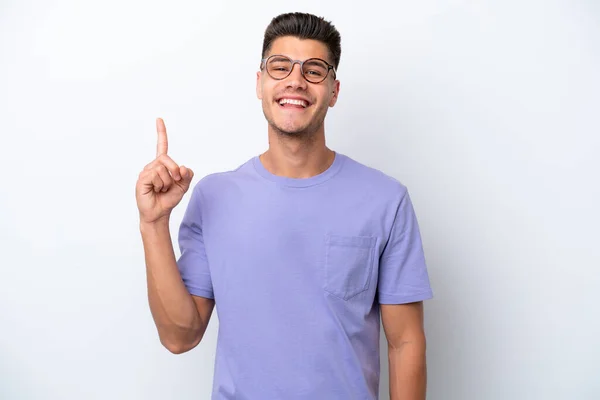 stock image Young caucasian man isolated on white background showing and lifting a finger in sign of the best