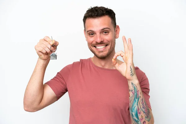 Young Caucasian Man Holding Home Keys Isolated White Background Showing — Stock Photo, Image