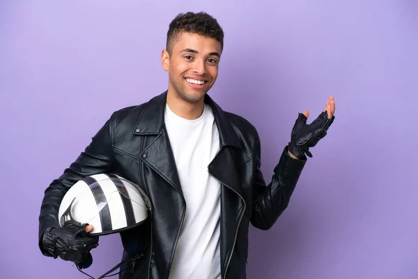 Young Brazilian Man Motorcycle Helmet Isolated Purple Background Extending Hands — Stok fotoğraf