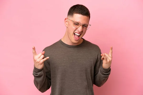 Young Brazilian Man Isolated Pink Background Making Horn Gesture — Stock Photo, Image