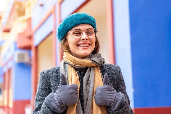 stock image Brunette woman at outdoors With glasses and with thumb up