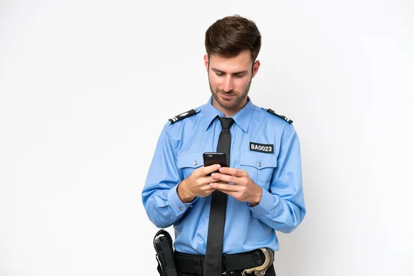 Young Police Caucasian Man Isolated White Background Sending Message Mobile — Zdjęcie stockowe