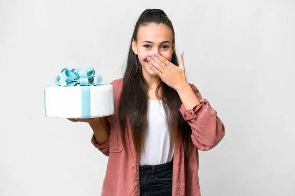 stock image Young Arabian woman holding birthday cake over isolated white background happy and smiling covering mouth with hand