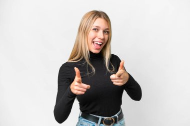 Young pretty blonde woman over isolated white background pointing to the front and smiling