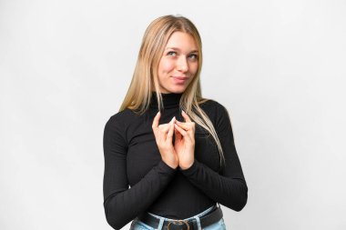 Young pretty blonde woman over isolated white background scheming something