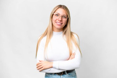 Young pretty blonde woman over isolated white background keeping the arms crossed in frontal position