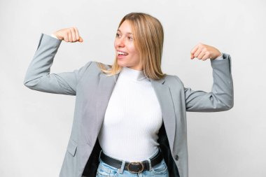 Young pretty blonde woman over isolated white background doing strong gesture