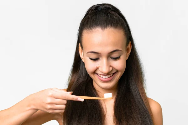 stock image Young Arabian woman over isolated white background with a toothbrush