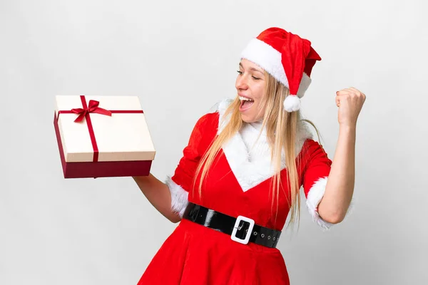 Young Blonde Woman Christmas Hat Holding Gift Isolated White Background — Stockfoto