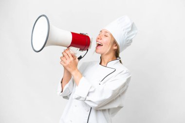 Young chef woman over isolated white background shouting through a megaphone