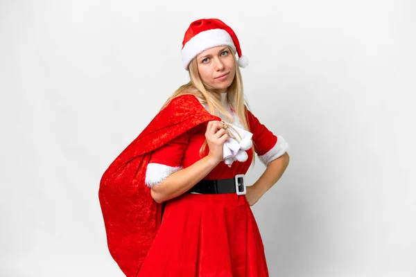 若いですブロンド女性とともにクリスマス帽子上の隔離された白い背景とともに悲しい表現 — ストック写真