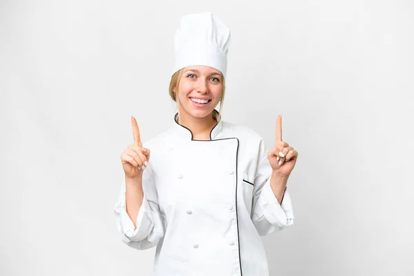 Jonge Chef Kok Vrouw Geïsoleerde Witte Achtergrond Wijzend Een Geweldig — Stockfoto