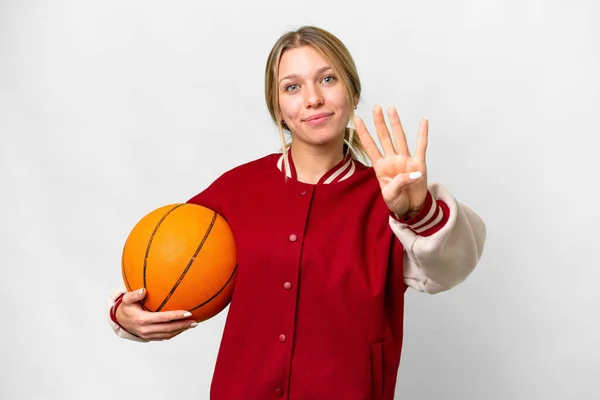 年轻的金发女子在孤独的背景下打篮球快乐地打篮球 用手指数着四个 — 图库照片
