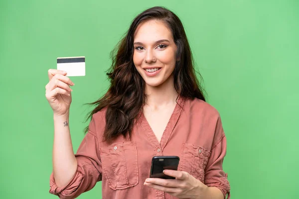 Young Caucasian Woman Isolated Background Buying Mobile Credit Card — Stock Fotó
