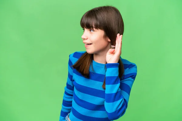 Little Caucasian Girl Isolated Background Listening Something Putting Hand Ear — Stock Photo, Image