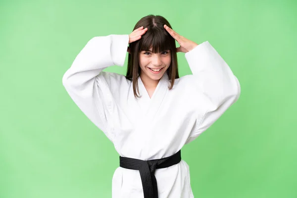 stock image Little Caucasian girl doing karate over isolated background with surprise expression