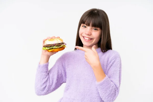 Little Caucasian Girl Holding Burger Isolated Background Pointing — 스톡 사진