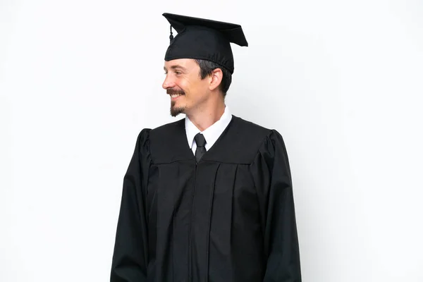 若い大学院生男隔離された白い背景を見る側 — ストック写真