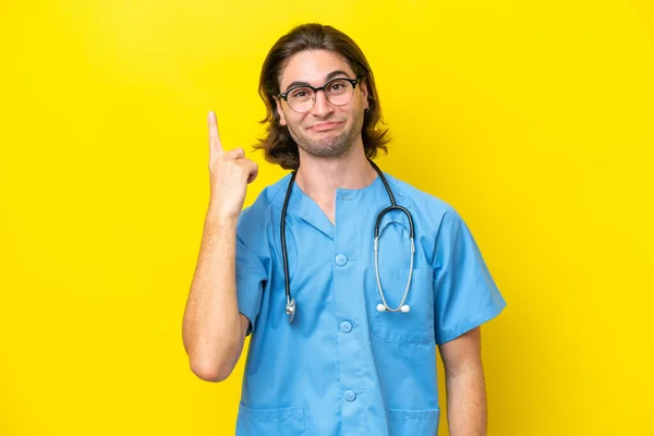 Young Surgeon Caucasian Man Isolated Yellow Background Pointing Index Finger — Zdjęcie stockowe