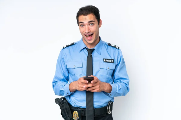 Young Police Caucasian Man Isolated White Background Surprised Sending Message — Stok fotoğraf