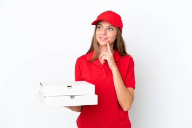 Pizza delivery Lithuanian woman isolated on white background thinking an idea while looking up