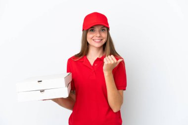 Pizza delivery Lithuanian woman isolated on white background pointing to the side to present a product