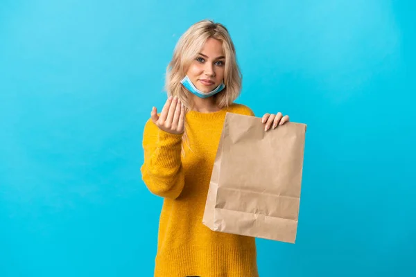 Young Russian Woman Holding Grocery Shopping Bag Isolated Blue Background — Stockfoto