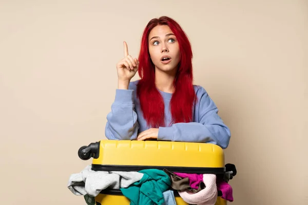 Traveler Girl Suitcase Full Clothes Isolated Beige Background Intending Realizes — Zdjęcie stockowe