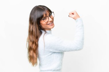 Young caucasian woman over isolated white background doing strong gesture