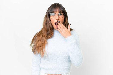 Young caucasian woman over isolated white background yawning and covering wide open mouth with hand