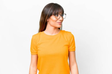 Young caucasian woman over isolated white background looking side