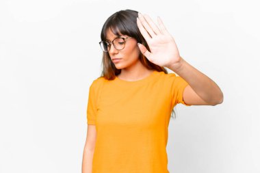 Young caucasian woman over isolated white background making stop gesture and disappointed