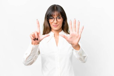 Young caucasian woman over isolated white background counting seven with fingers