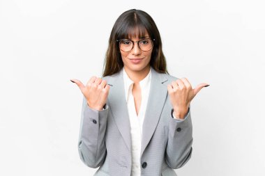 Young caucasian woman over isolated white background with thumbs up gesture and smiling