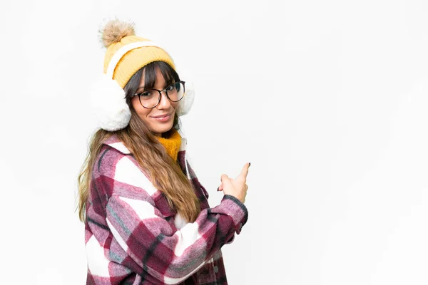 Young Caucasian Woman Wearing Winter Muffs Isolated White Background Pointing — Stock Photo, Image