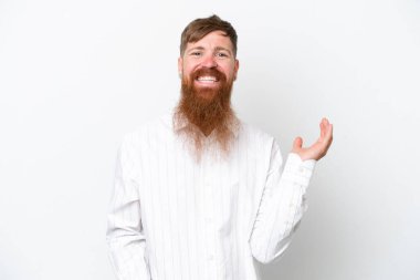 Redhead man with long beard isolated on white background extending hands to the side for inviting to come