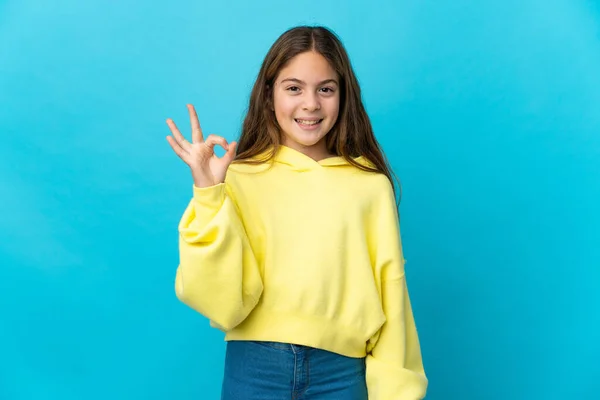 Niña Sobre Fondo Azul Aislado Mostrando Signo Con Los Dedos —  Fotos de Stock