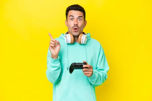 Young Handsome Man Playing Video Game Controller Isolated Wall Intending — Stock Photo, Image