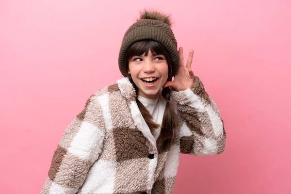 Little Caucasian Girl Winter Jacket Isolated Pink Background Listening Something — Fotografia de Stock