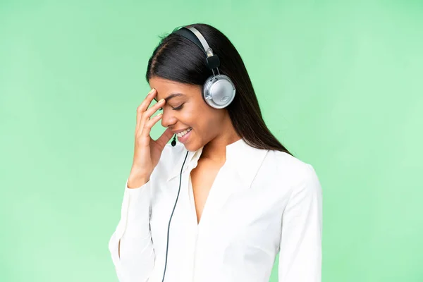 stock image Telemarketer African American woman working with a headset over isolated chroma key background laughing