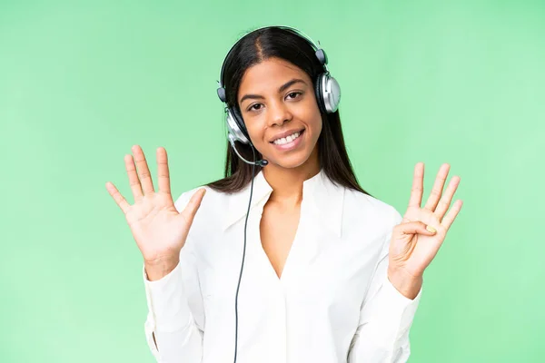 stock image Telemarketer African American woman working with a headset over isolated chroma key background counting nine with fingers