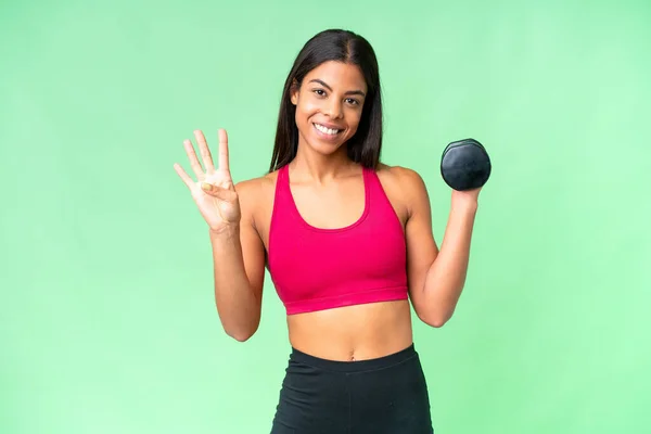 Young African American woman sport woman making weightlifting over isolated chroma key background happy and counting four with fingers