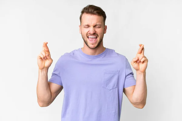 Young Handsome Caucasian Man Isolated White Background Fingers Crossing — Stock Fotó
