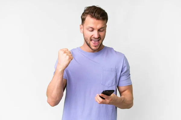 Young Handsome Caucasian Man Isolated White Background Phone Victory Position — Zdjęcie stockowe