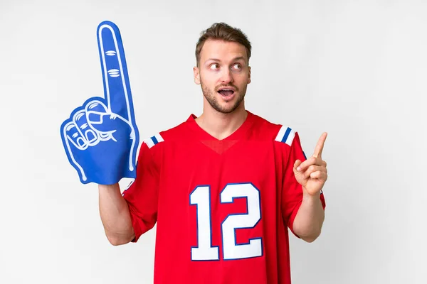 stock image Young caucasian sports fan man over isolated white background intending to realizes the solution while lifting a finger up