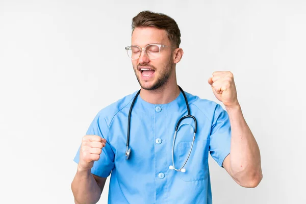 Jovem Enfermeira Homem Sobre Isolado Fundo Branco Celebrando Uma Vitória — Fotografia de Stock