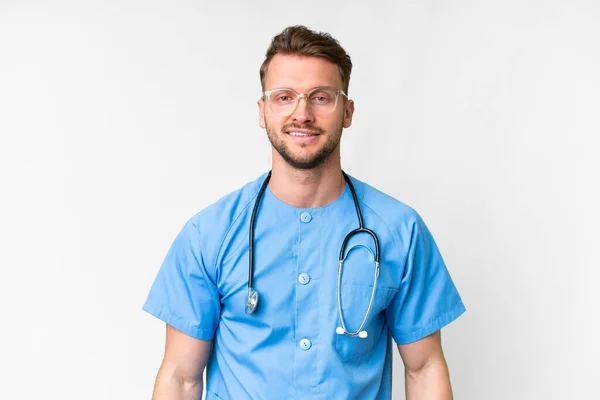 Jovem Enfermeira Homem Sobre Isolado Fundo Branco Com Óculos Feliz — Fotografia de Stock