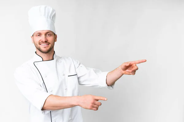 Young Caucasian Chef Isolated White Background Pointing Finger Side Presenting — 스톡 사진
