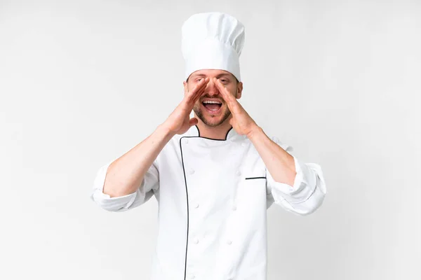 Young Caucasian Chef Isolated White Background Shouting Announcing Something — Stok fotoğraf